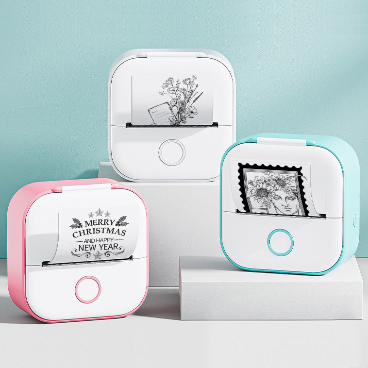 Three small printer devices with printed designs on a light blue background