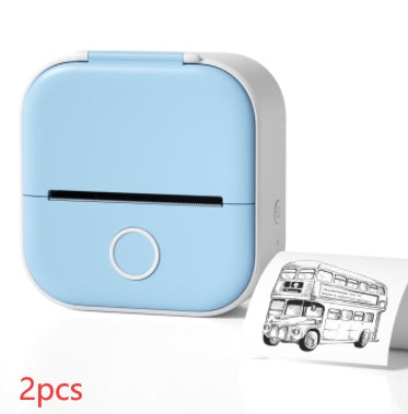 Small blue printer with a printed card featuring a double-decker bus on a white background