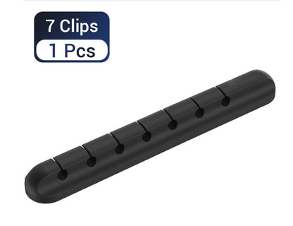 Cable management clips keeping wires organized on a desk