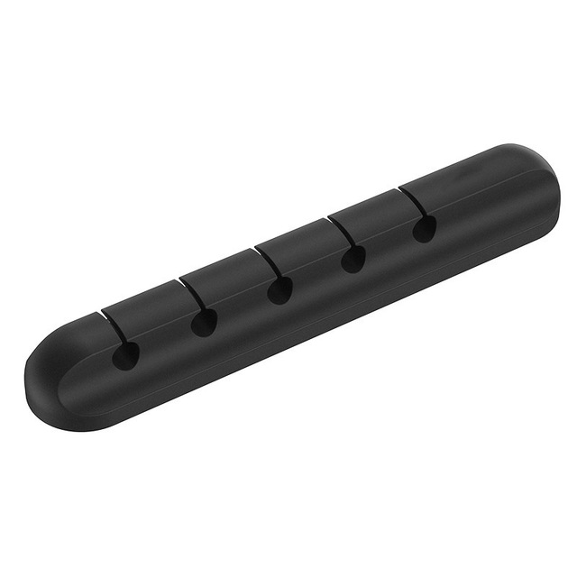 Charging cable holder keeping cords neatly positioned on a desk