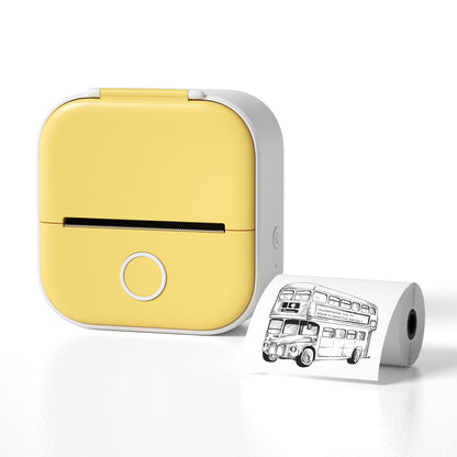 Yellow portable printer with a roll of paper featuring a black and white illustration of a bus on a white background