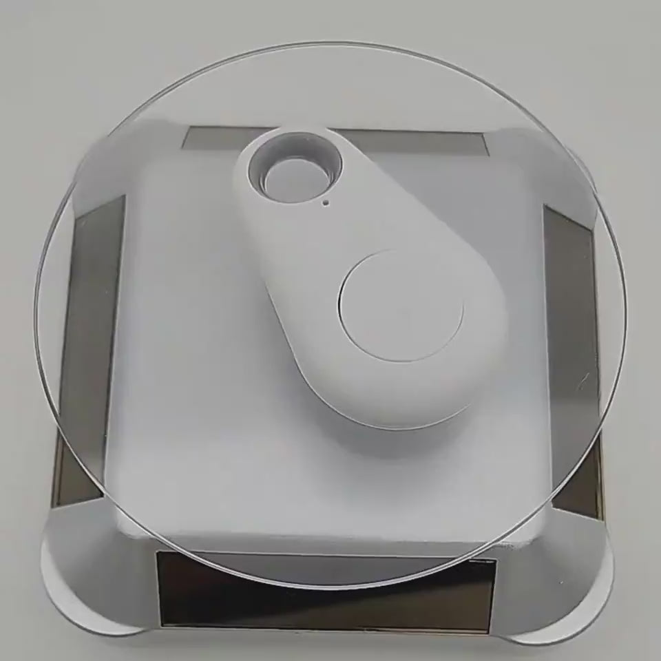 Bluetooth item finder attached to keys demonstrating a convenient way to keep track of everyday essentials.