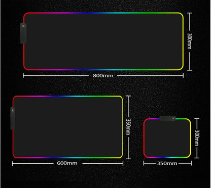 RGB LED gaming mouse pad with customizable colors for a stylish and organized computer desk setup.